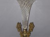 a glass vase that is sitting on a table