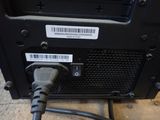 a close up of a computer with a cable plugged into it