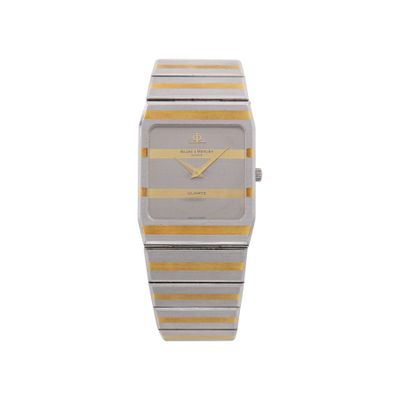 un gros plan d'une montre dont le cadran est orné d'une bande jaune