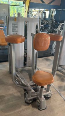 three chairs that are sitting in a gym room