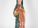 an image of a statue of a woman holding a cross on a white background