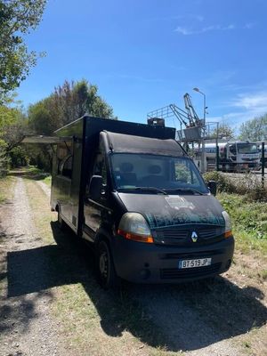 a black van that is parked on the side of the road