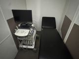 a black table with a computer on it in a room