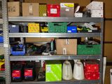 a metal shelving with many different items on it
