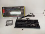 a keyboard and a mouse on a table with a box