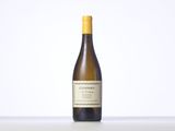 a bottle of white wine sitting on top of a table