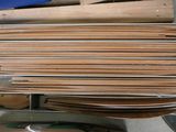 a pile of wood that is sitting on a shelf