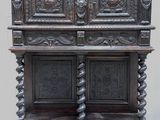 an old wooden cabinet with carvings and carvings on the doors