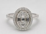 a white gold and diamond ring with a center stone surrounded by smaller diamonds