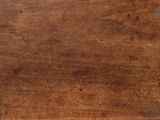 a close up of a wooden table with a knife and fork on it