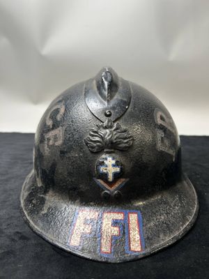 an old fireman ' s helmet with the emblem of a fire department