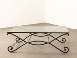 an image of a glass table with a metal frame on top