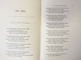 an open book with a poem in it on a table