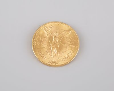 an image of a gold coin sitting on top of a white surface
