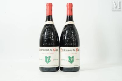 two bottles of red wine sitting next to each other on a table