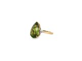 a close up of a green tourmaline and diamond ring