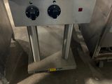 an image of a kitchen stove with two burners on top of it