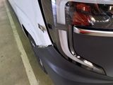 a close up of a truck ' s headlight and front bumper