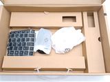a box with a keyboard and a glove in it