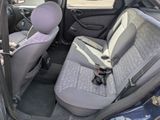 two seats in the back of a car with a seat belt