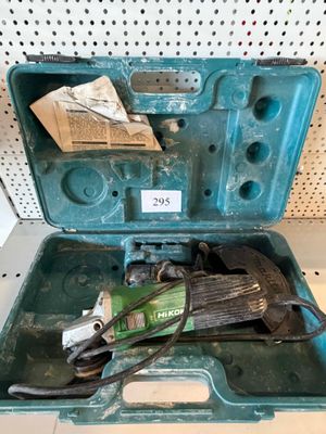 a green tool case with tools inside of it