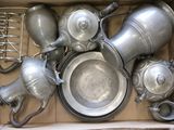 a box full of silver pots and pans in it