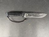 a knife that is laying on a table