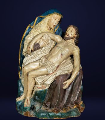 an image of a statue of jesus laying on the cross