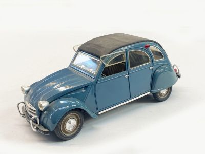 a toy car that is sitting on a white surface