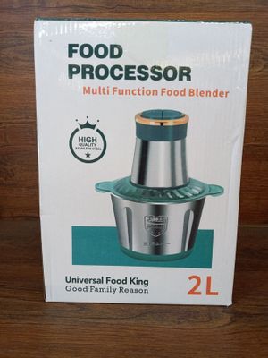 packaging of a multi function food blender sitting on a wooden table
