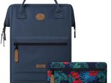 a blue backpack and a blue purse with tropical print