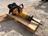 a yellow and black object on a pallet on the ground