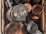 a box full of pots and pans sitting on a table