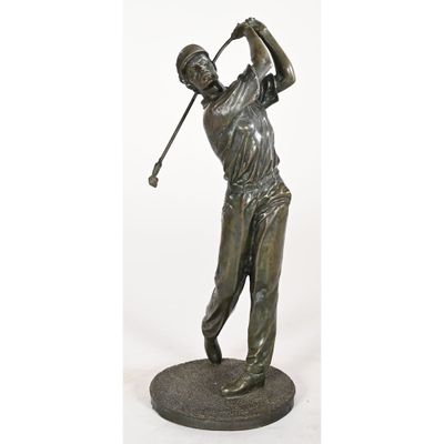 a statue of a man swinging a golf club on a base