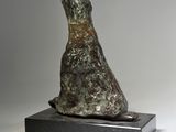 bronze sculpture of a howling wolf on a black marble base
