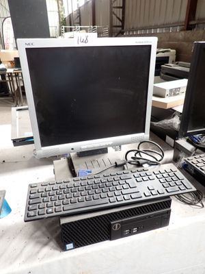 a desktop computer with a keyboard and monitor on a table