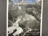 a black and white photo of a mountain with a picture of a river