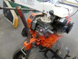 a small machine that is sitting on the ground