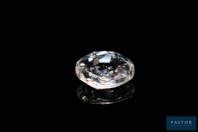 a close up of a diamond on a black surface