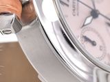 a close up of a watch with a leather strap