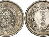 a silver coin with an image of a woman and a dragon on it