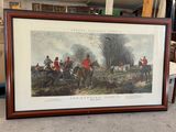 an image of a framed picture of a group of men riding horses