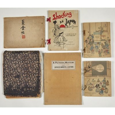 a group of old books sitting on top of a table