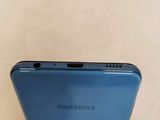 a close up of the back of a blue samsung galaxy s9