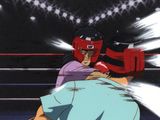 une image représentant un homme dans un ring de boxe, coiffé d'un casque rouge