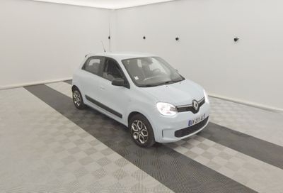 a picture of a small white car in a garage