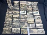 a lot of old black and white photos on the table
