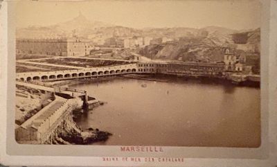an old photo of a bridge over a body of water