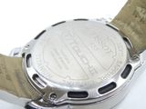 a close up of a watch on a white surface