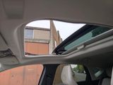 a view of the inside of a car with the sunroof